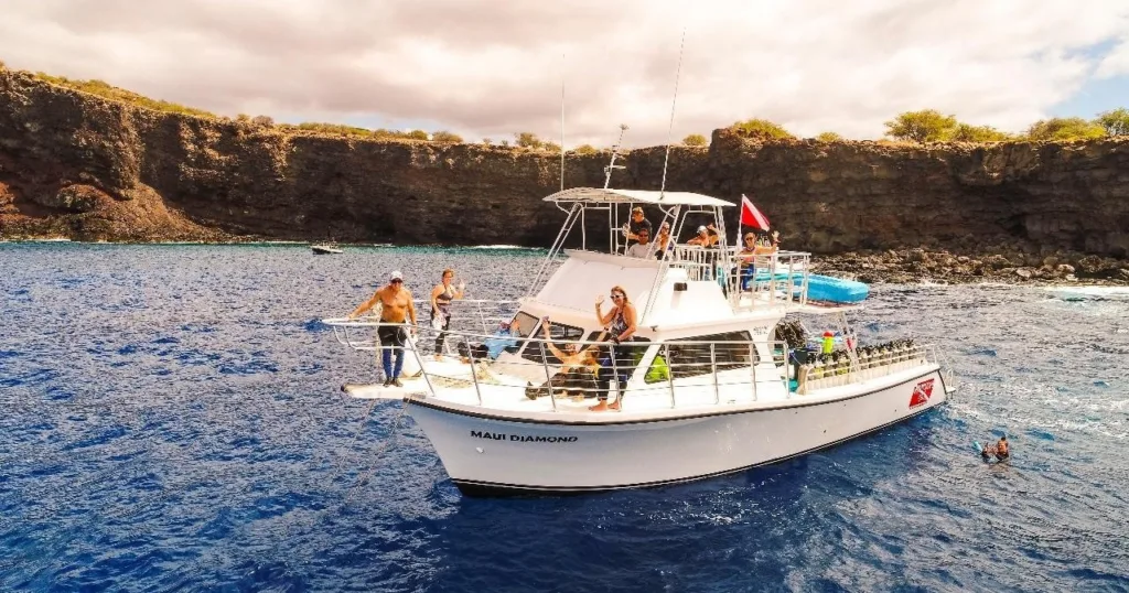 Scuba diver exploring vibrant underwater world off Maui coast