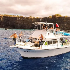 Scuba diver exploring vibrant underwater world off Maui coast