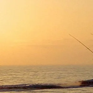 Sunset cruise boat sailing near Waikiki coastline