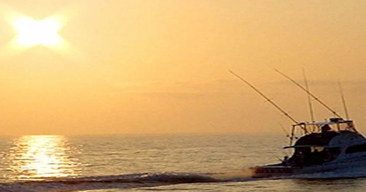 Sunset cruise boat sailing near Waikiki coastline