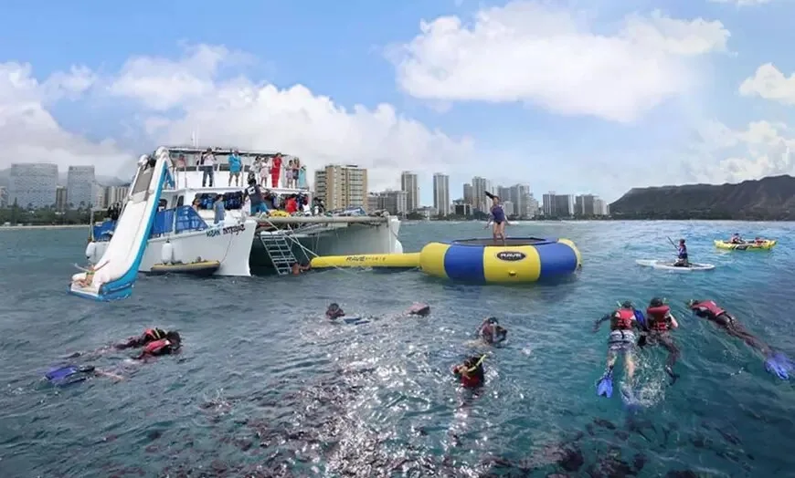 Large boat cruising Waikiki waters on tour