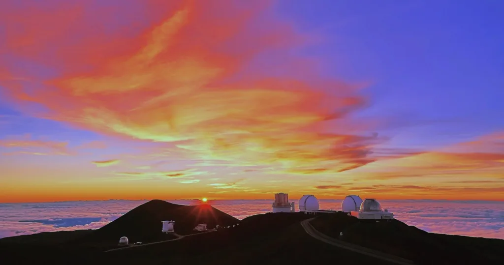 Tourists watching sunset from Mauna Kea summit