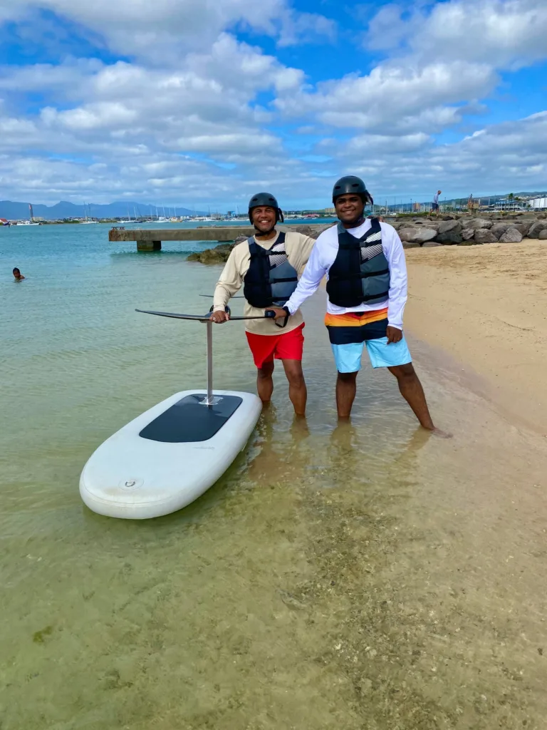 Group enjoying mid length eFoil experience on open water