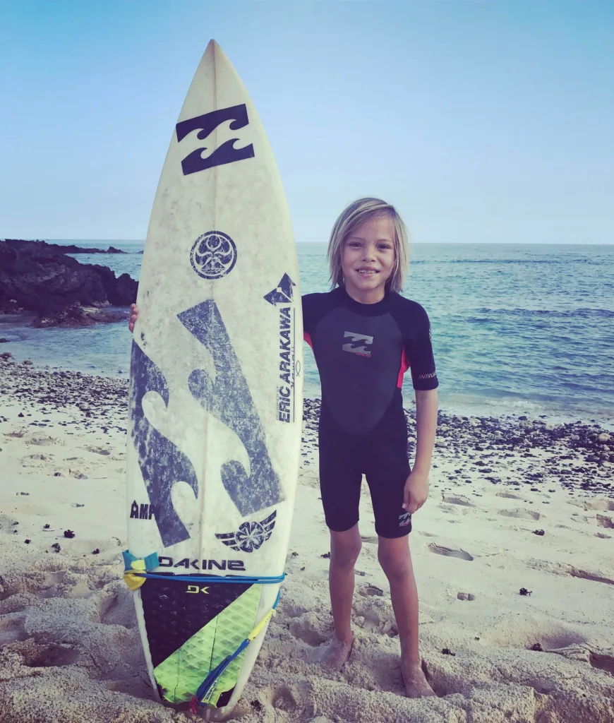 Individual receiving focused private surf instruction