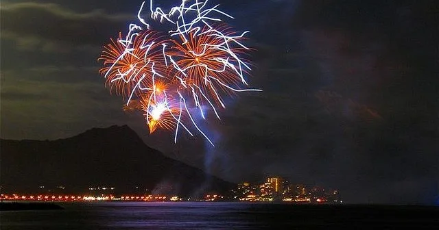 Fireworks display viewed from a festive evening cruise