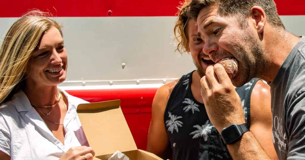 Tour group sampling local foods on Honolulu sites and bites tour