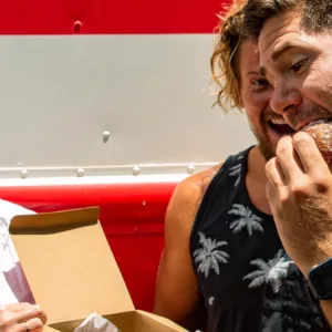Tour group sampling local foods on Honolulu sites and bites tour