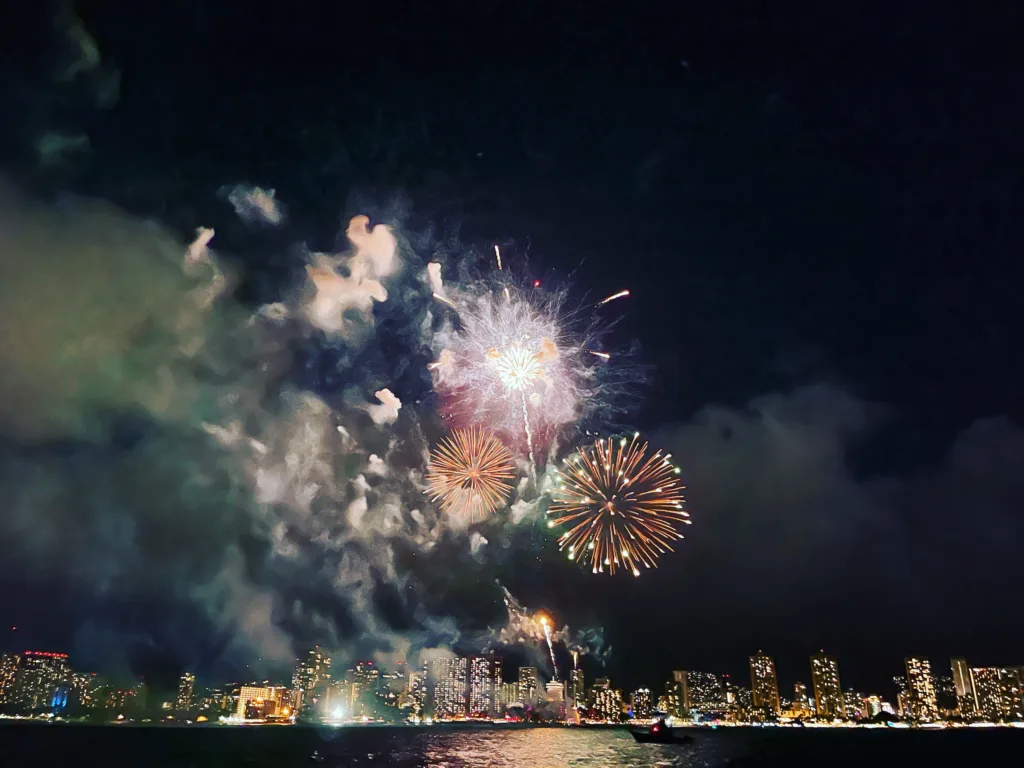 Boat cruising Waikiki waters during Friday night fireworks