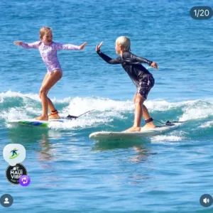 Two people enjoying semi-private surf lesson together