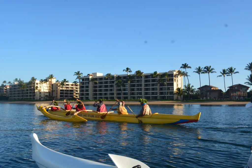 Traditional canoe gliding over calm island waters