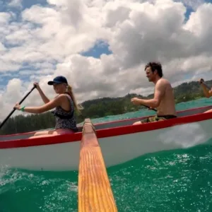 Canoe tour at Kawela Bay with scenic mountain backdrop