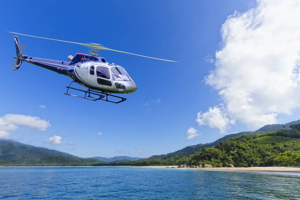 Helicopter flying over active Hawaiian volcano landscape