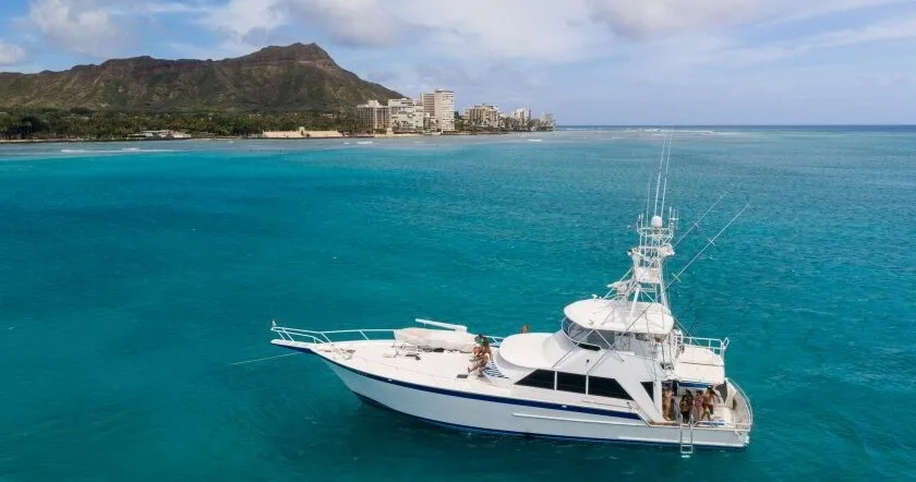 Private boat anchored near tropical island shore