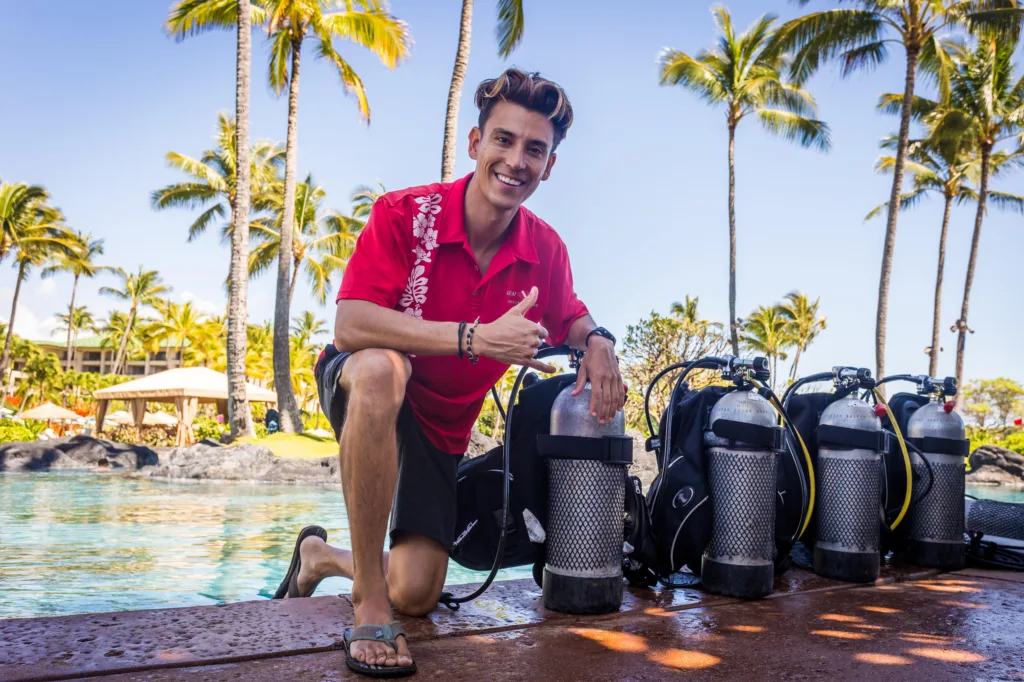 Beginner scuba diver practicing in hotel pool