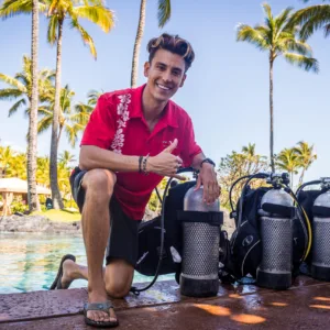 Beginner scuba diver practicing in hotel pool