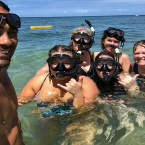 Aerial view of a secluded private island in clear blue water