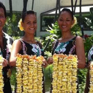 Welcoming visitor with traditional lei at Honolulu airport