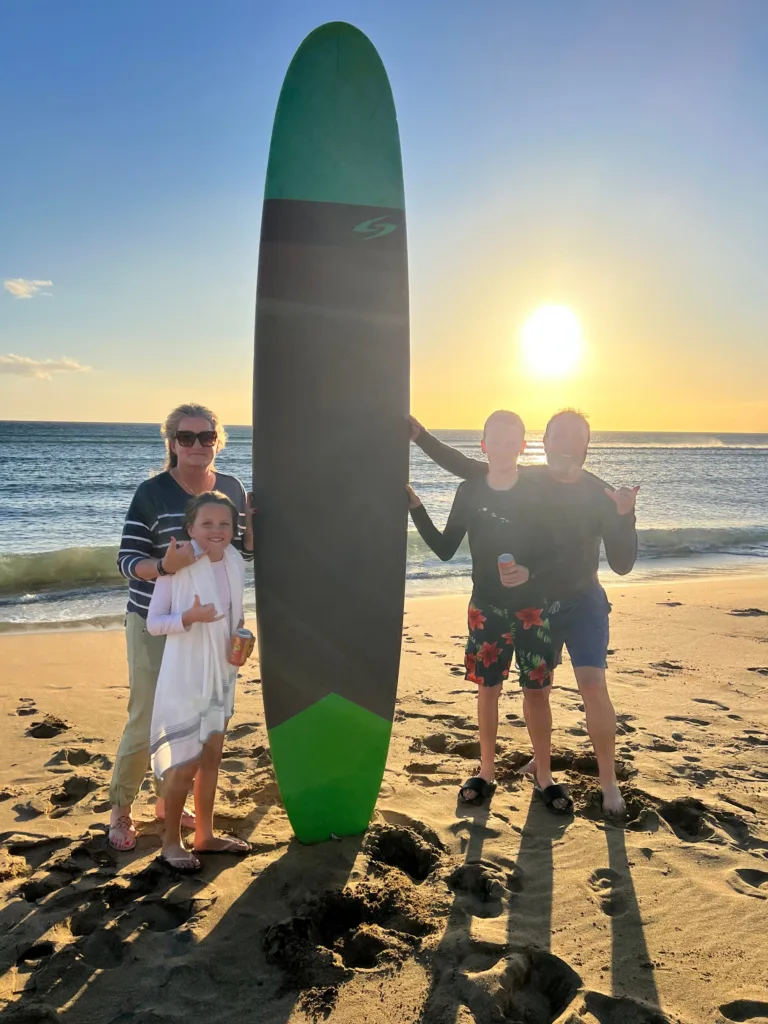 Group enjoying surf lessons on Maui beach
