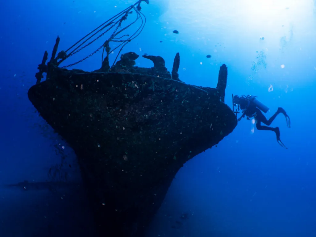 Guided scuba diving exploring deep and shallow reefs