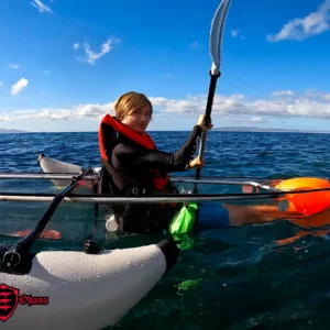 Clear kayak gliding over vibrant coral reef waters