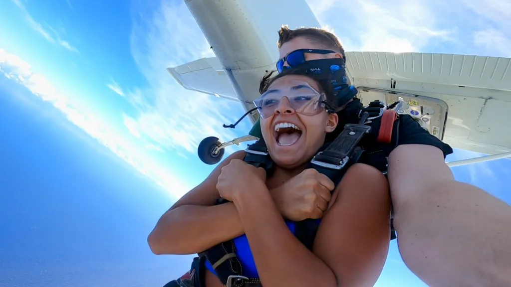 Skydiver freefalling over scenic Kohala Coast Big Island