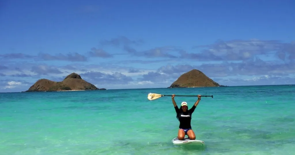 Paddleboarders exploring calm waters along Kohala Coast