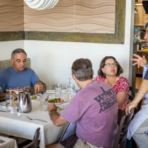 Tour group enjoying local food along tropical coast