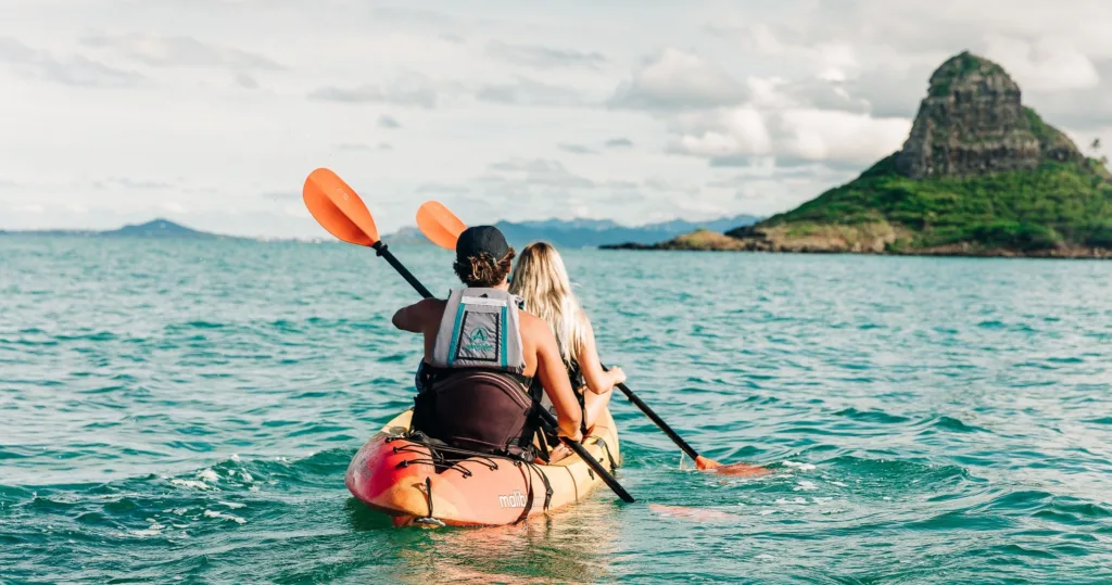 Kayaking near Chinaman's Hat island in calm ocean waters