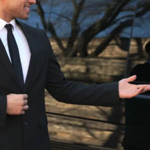 Transit van waiting outside airport terminal for pickup