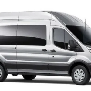 Transit van dropping off passengers at airport terminal