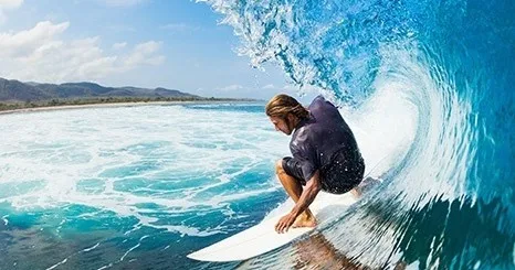 Instructor guiding students on stand up paddle boards