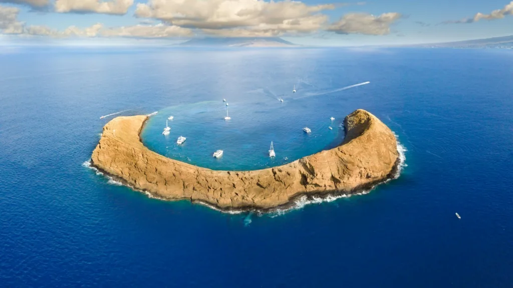 Snorkeling at Molokini crater with clear turquoise waters