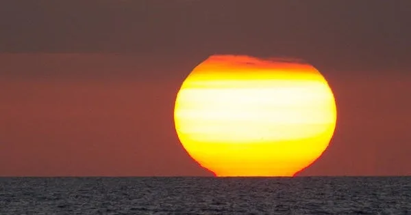 Adults sailing at sunset near Ma'alaea harbor