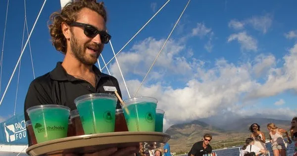 Guests enjoying a sunset cocktail cruise in Ma'alaea harbor