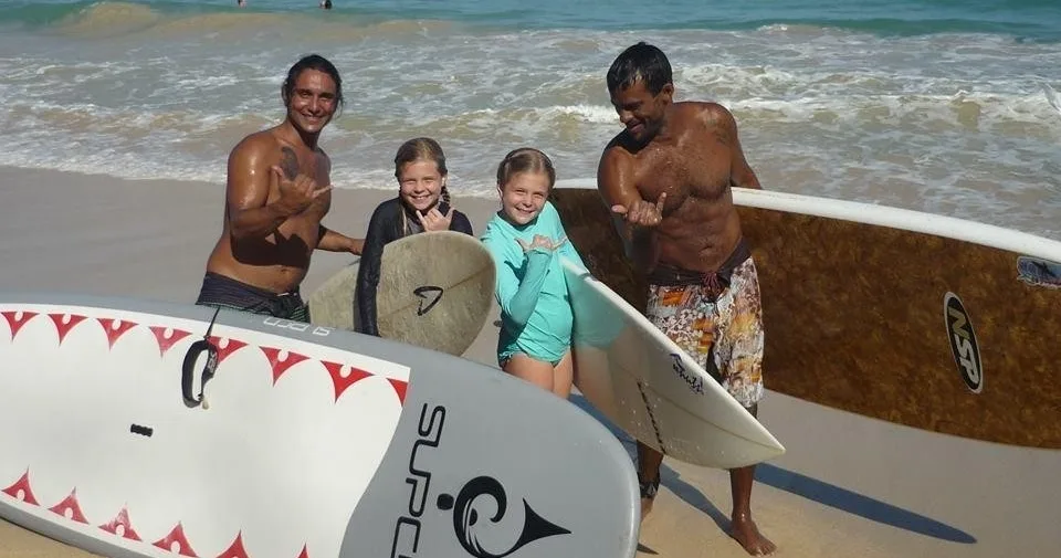 Instructor teaching stand up paddleboarding technique on calm water