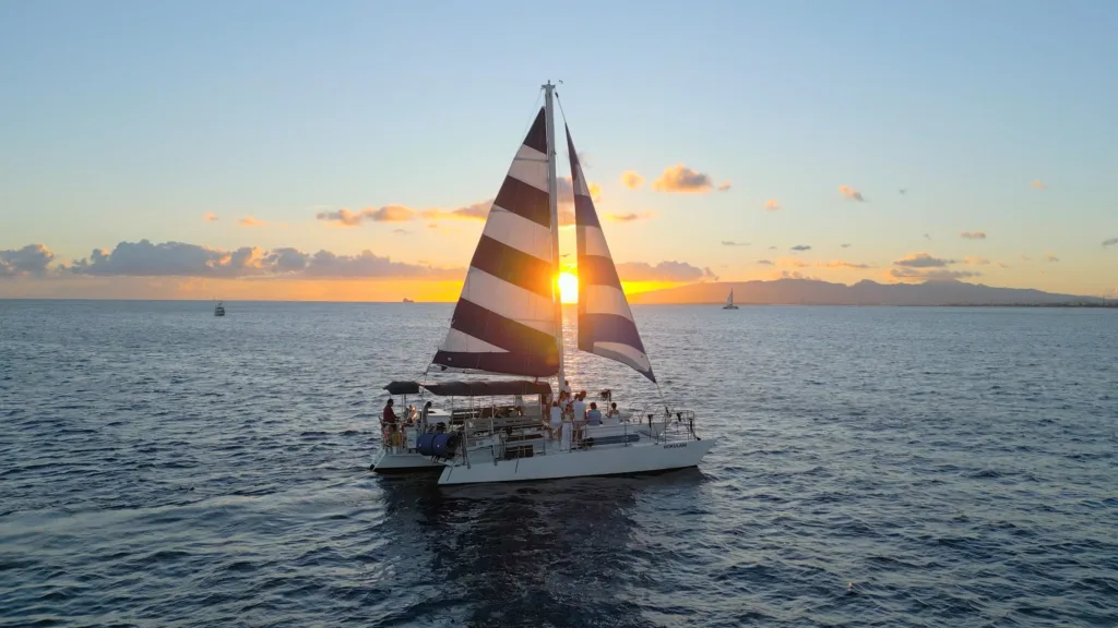 Sailing along Waikiki coast during a stunning sunset