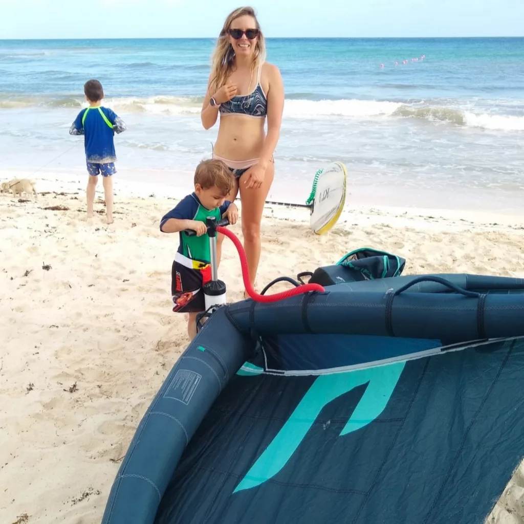 Kids learning wingfoiling on gentle Maui ocean waves