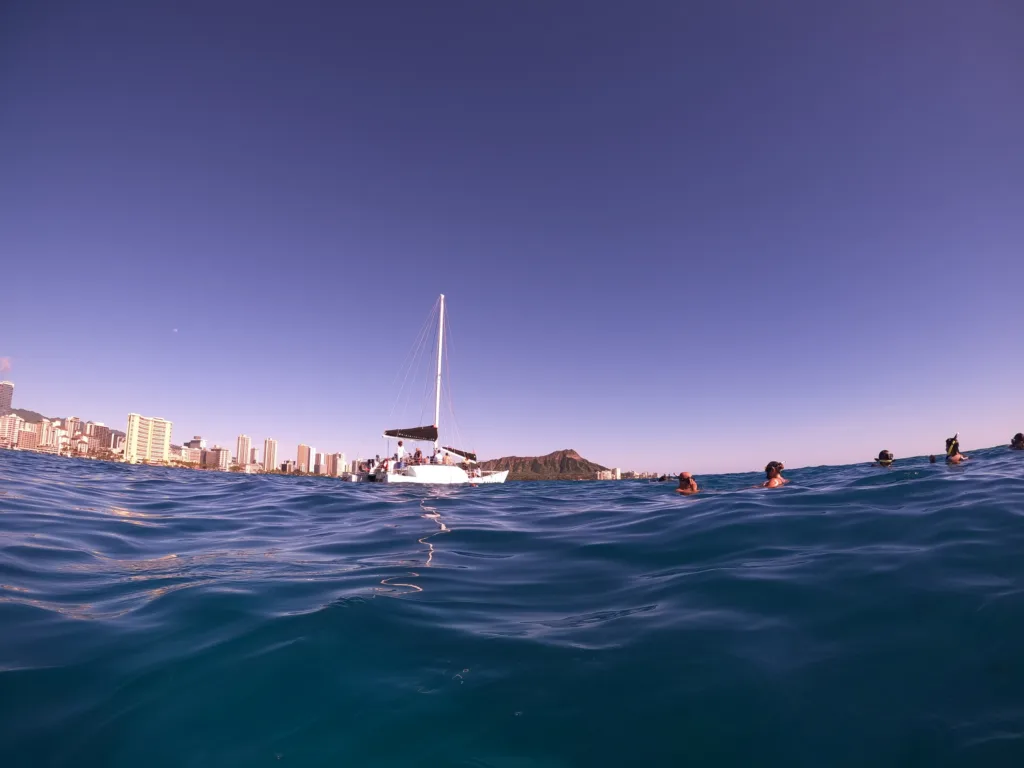 Scuba divers exploring vibrant coral reefs near Honolulu