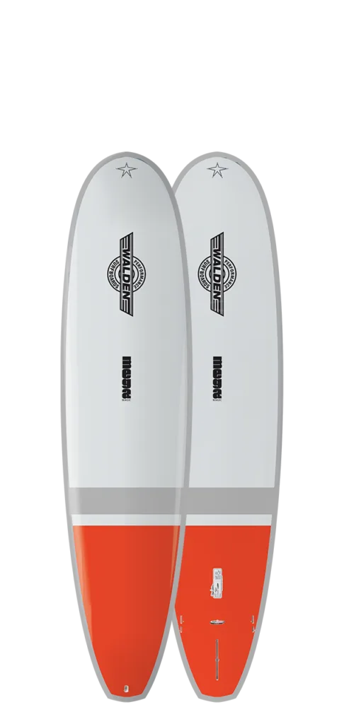 Two day rental surfboard parked on sandy beach at sunset