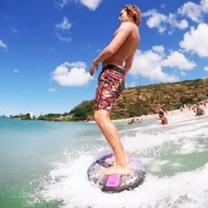 Private skimboarding lesson on sandy beach