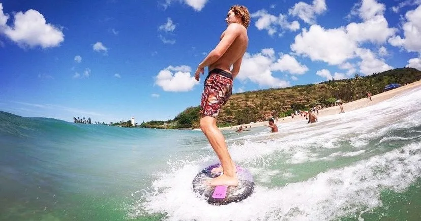 Private skimboarding lesson on sandy beach