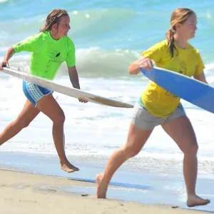 Semi-private skimboarding class with two participants