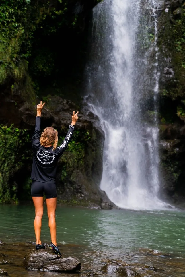 Luxury vehicle parked at trailhead for Maui hike