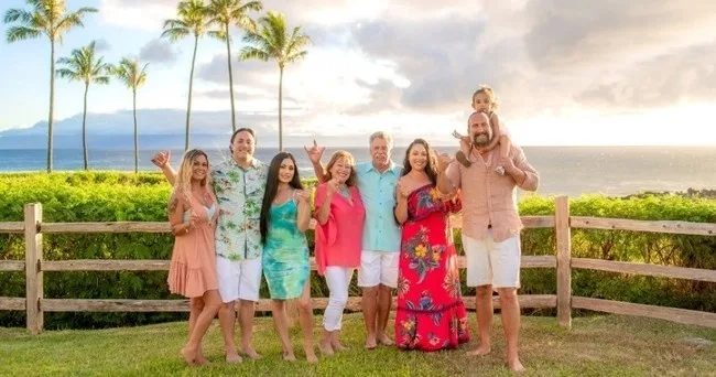Extended family gathering for a group photo outdoors