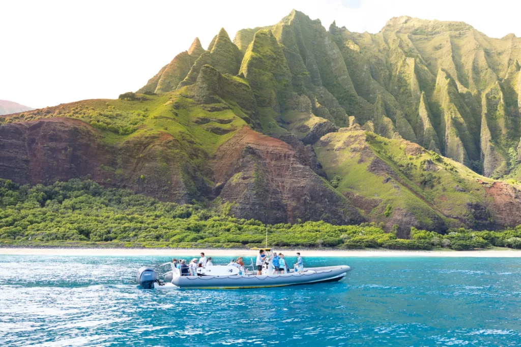 Afternoon boat tour exploring Nāpali Coast’s dramatic cliffs