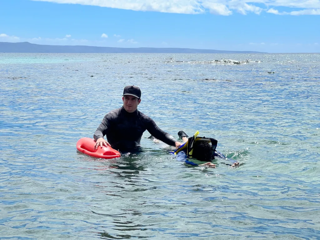 Non-swimmers learning snorkeling basics in calm waters