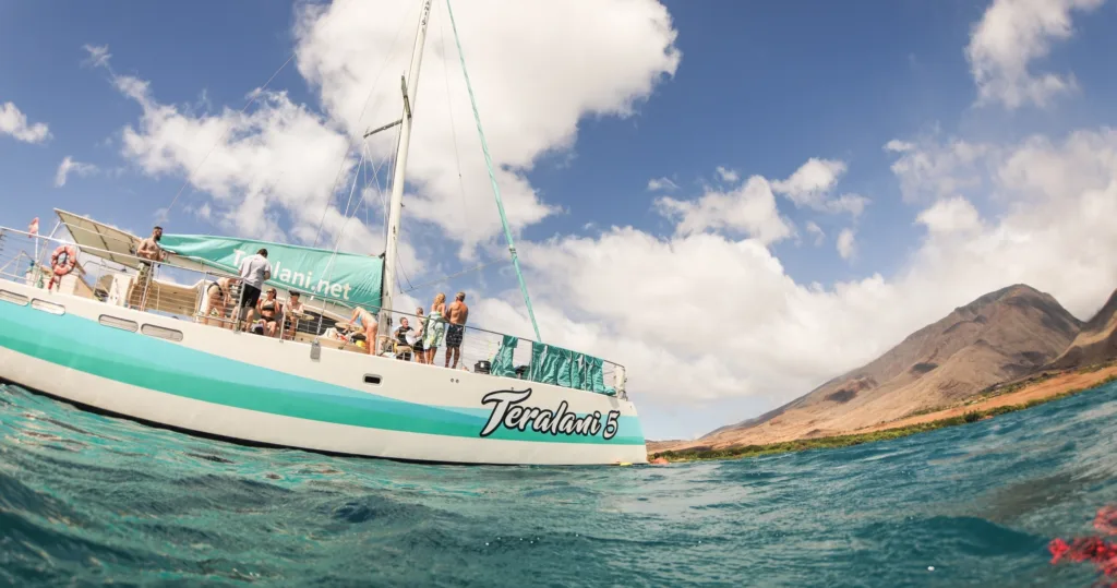 Snorkelers exploring coral reefs during West Maui sail tour