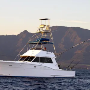 Fishing boat heading out for private deep sea fishing charter