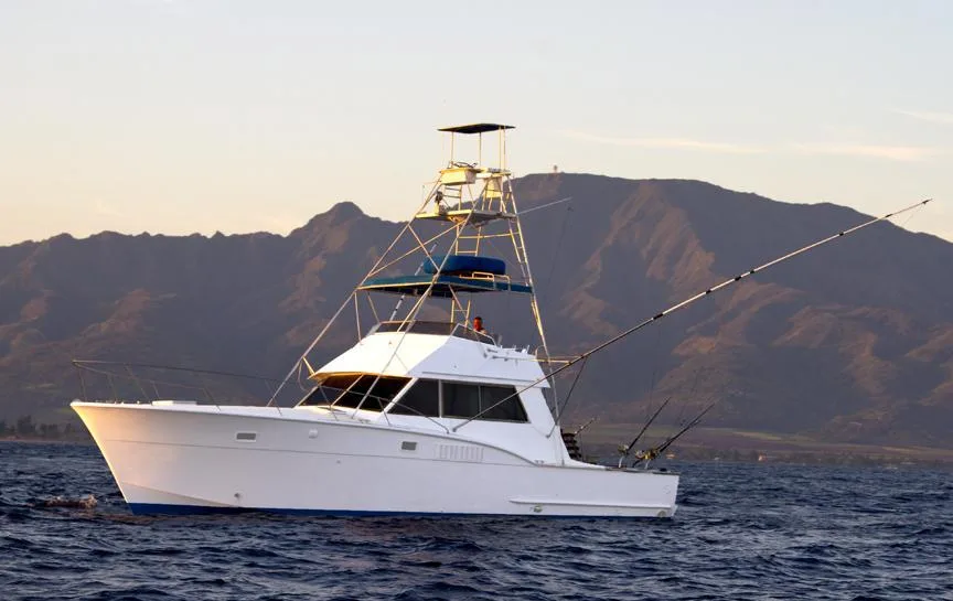 Fishing boat heading out for private deep sea fishing charter