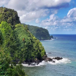 Hikers trekking the Hana Ali’i trail in Maui